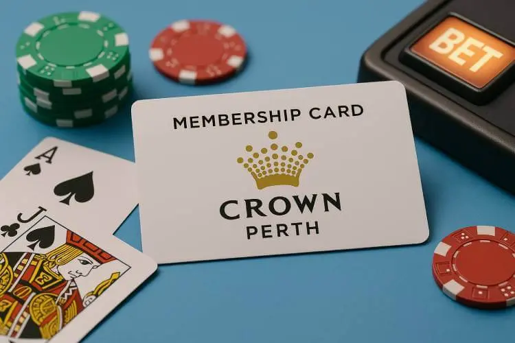 A Crown Perth membership card placed on a light blue surface with casino chips, blackjack cards, and a slot machine bet button.